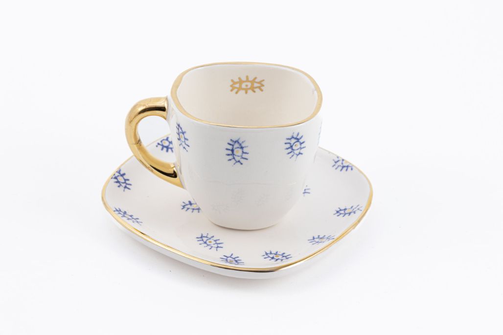 Gold Handle Evil Eye Ceramic Tea Cup & Saucer - Featured Image Gold Handle Evil Eye Ceramic Tea Cup & Saucer - Image 1